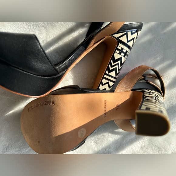 The sandals are high heeled, with a black, beige and white color combination. - Picture 3 of 8